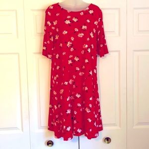 Knee length dress. 3/4 length sleeves size M. Floral print, deep pink